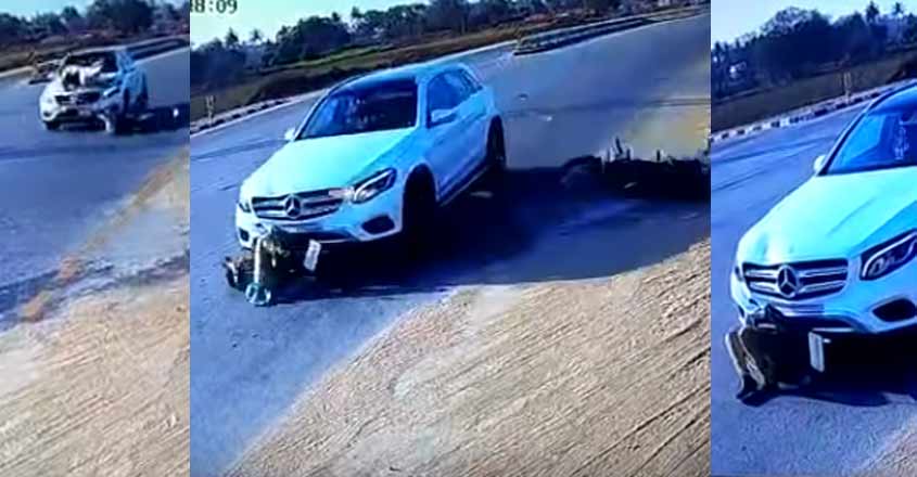 അശ്രദ്ധമായി  ബൈക്ക് തിരിച്ചു: ജീവൻ തിരിച്ചു കിട്ടിയത്  തലനാരിഴയ്ക്ക്; തെറിച്ചു വീണത് എസ് യു വി യുടെ  ടയറിനടിയിൽ