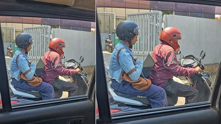 ട്രാഫിക് ബ്ലോക്കിനിടയിൽ ലാപ്ടോപ്പിൽ ജോലി ചെയ്യുന്ന യുവതി: ചിത്രം ശ്രദ്ധനേടുന്നു