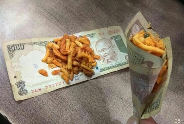 നോട്ടുകളില്‍ കപ്പലണ്ടിയും പലഹാരങ്ങളും പൊതിഞ്ഞ ചിത്രം പ്രചരിപ്പിച്ചവര്‍ കുടുങ്ങിയേക്കും